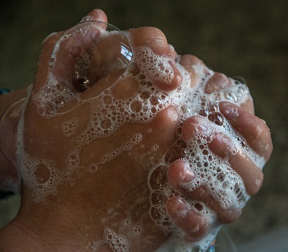 A picture of hands being washed